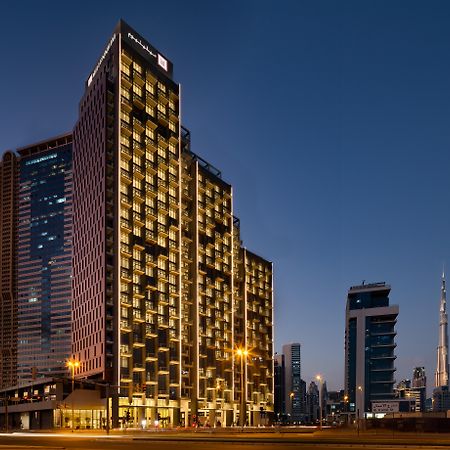 มิลเลนเนียม เอเตรีย บิสซิเนส เบย์ Aparthotel ดูไบ ภายนอก รูปภาพ The hotel at night