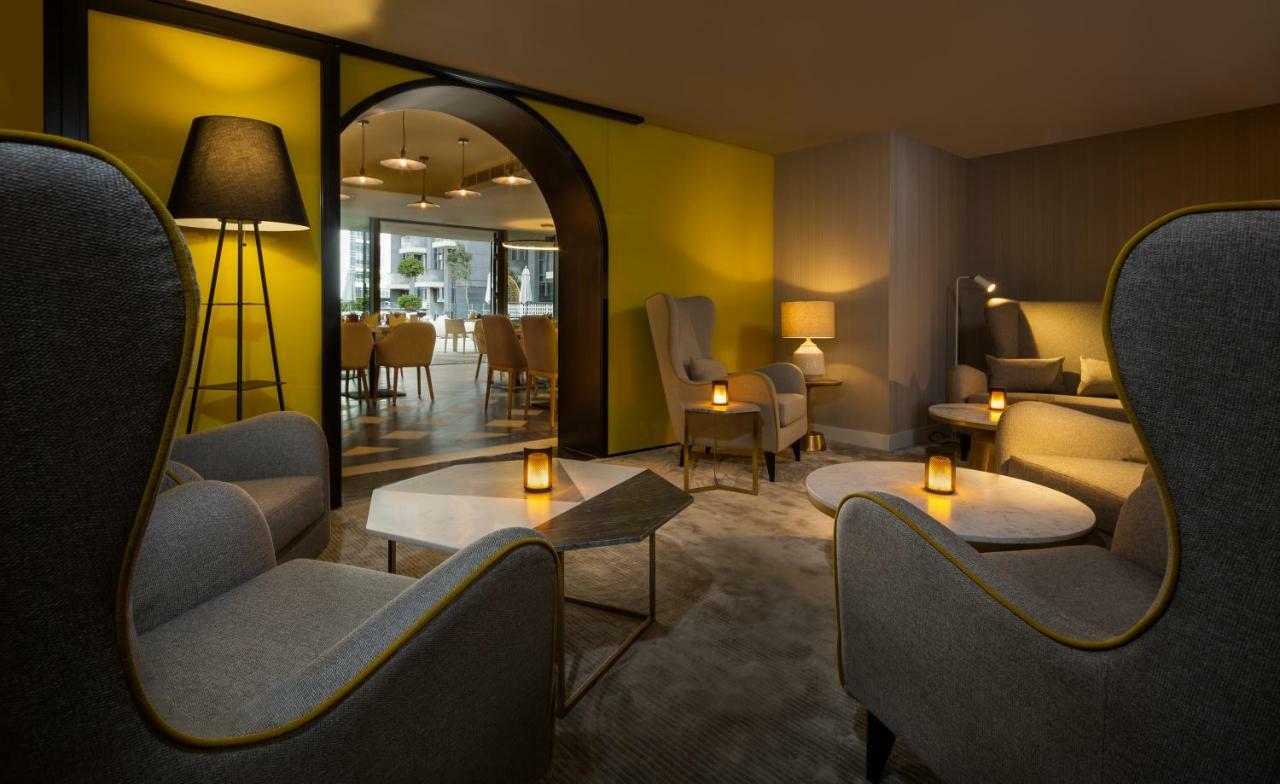มิลเลนเนียม เอเตรีย บิสซิเนส เบย์ Aparthotel ดูไบ ภายนอก รูปภาพ The lounge at the hotel